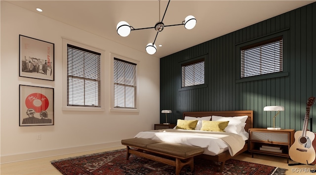 bedroom featuring wooden walls