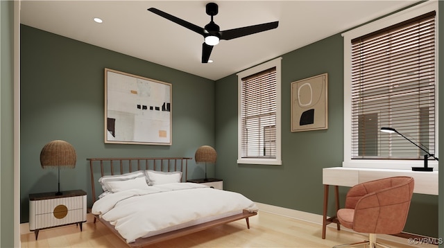 bedroom with light hardwood / wood-style floors and ceiling fan