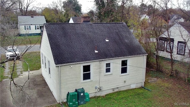 rear view of house with a lawn