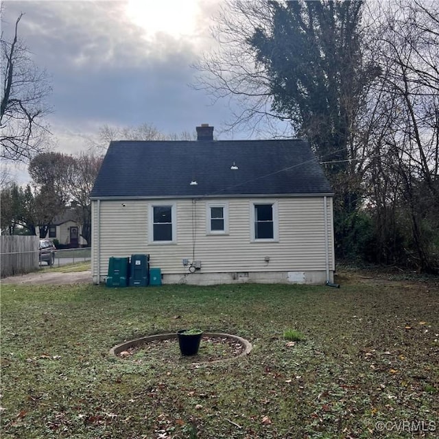 back of house with a yard