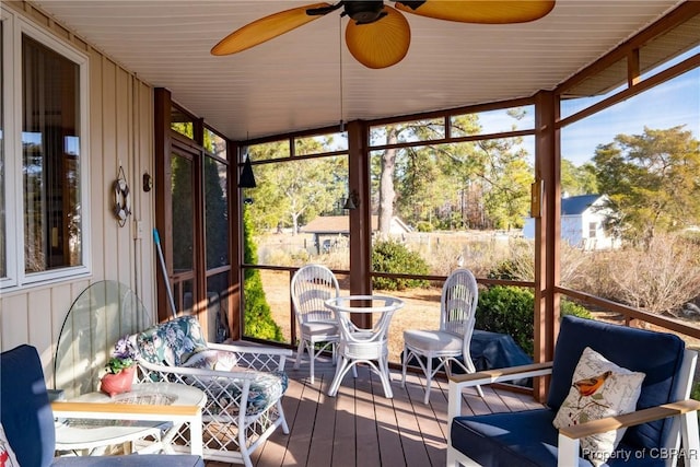 sunroom featuring plenty of natural light and ceiling fan