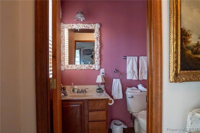 bathroom with vanity and toilet