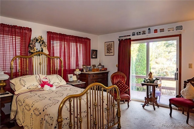 carpeted bedroom featuring access to exterior