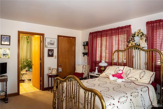 bedroom featuring light colored carpet