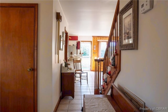 hall with light tile patterned flooring