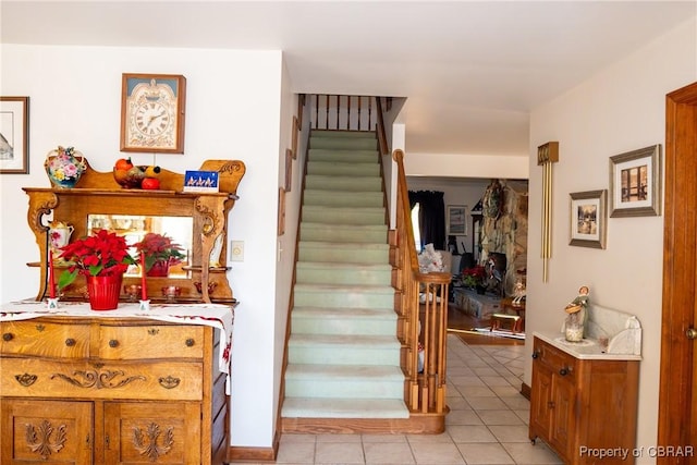 stairs with tile patterned floors