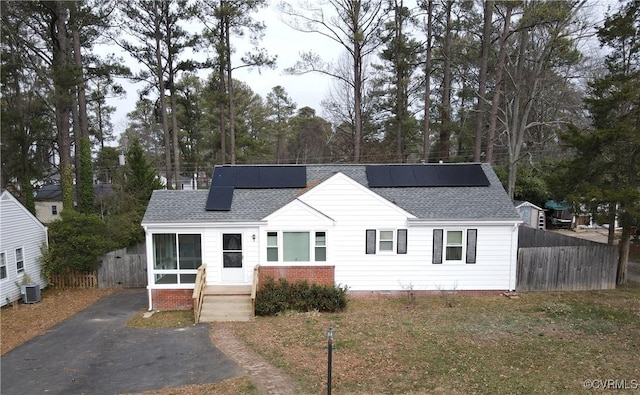 view of front of house featuring solar panels