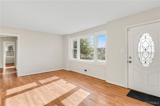 entryway with light hardwood / wood-style floors