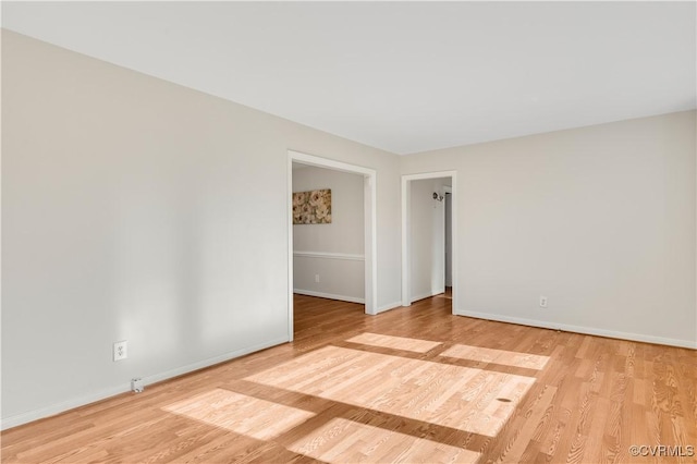 spare room with light wood-type flooring