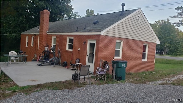 back of house with a patio area