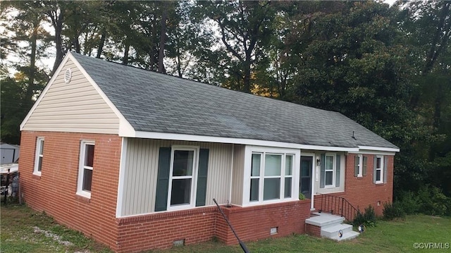 view of home's exterior with a yard