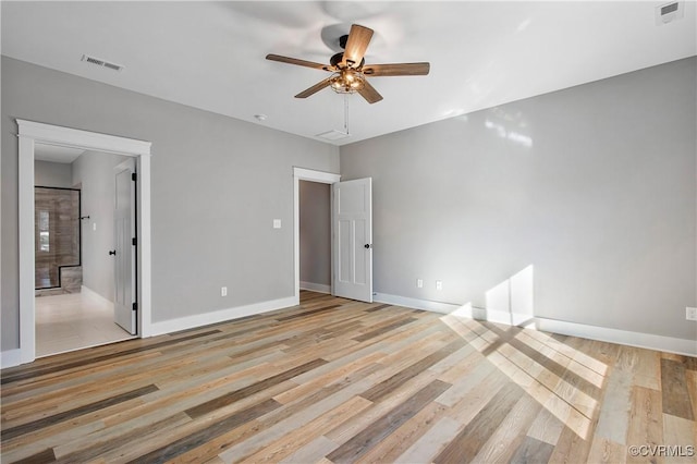 spare room featuring ceiling fan and light wood-type flooring