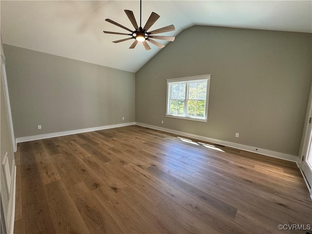 spare room featuring lofted ceiling, ceiling fan, and dark hardwood / wood-style flooring