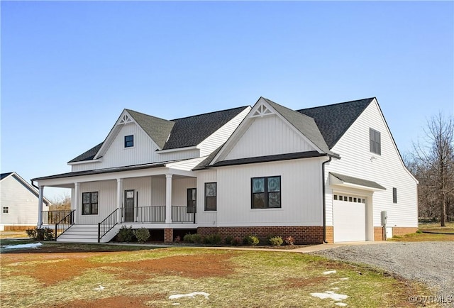 modern inspired farmhouse featuring a porch and a garage