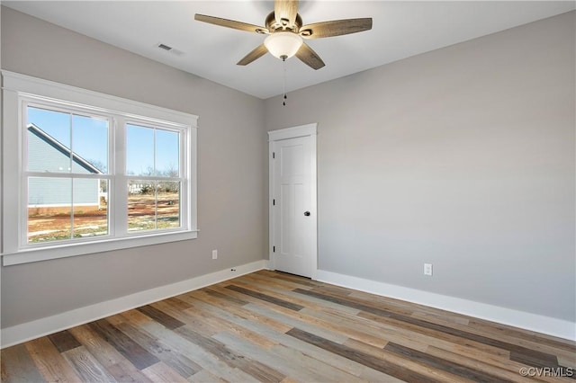 unfurnished room with ceiling fan and light hardwood / wood-style flooring