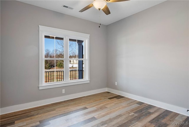 empty room with light wood-type flooring and ceiling fan