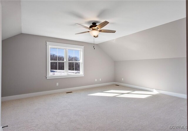 bonus room with ceiling fan, lofted ceiling, and carpet flooring