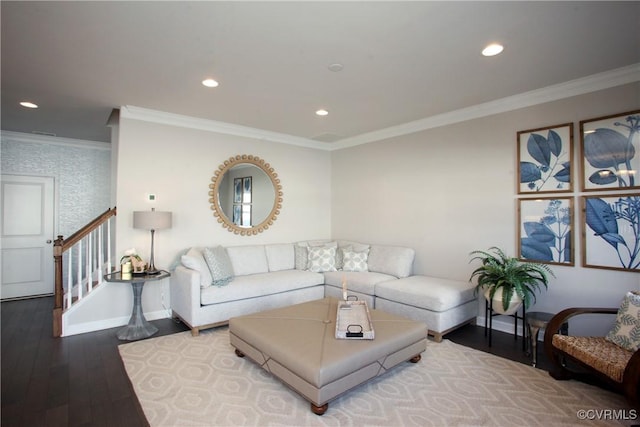 living room featuring hardwood / wood-style flooring and ornamental molding