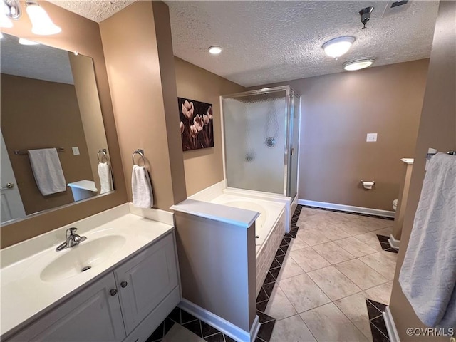 bathroom featuring vanity, shower with separate bathtub, a textured ceiling, and tile patterned floors