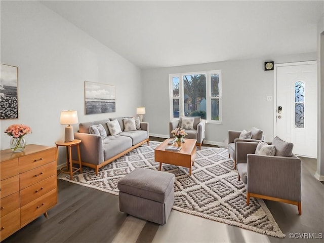 living room featuring lofted ceiling and dark wood-type flooring