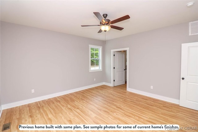 empty room with ceiling fan and hardwood / wood-style flooring