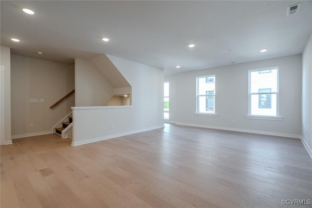 unfurnished living room featuring light wood-type flooring