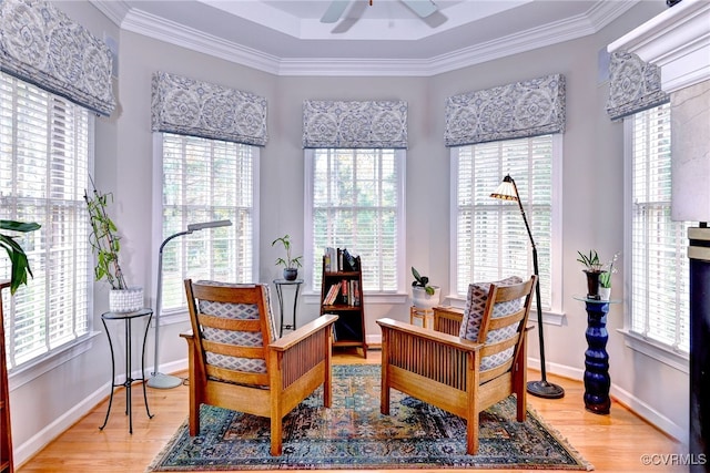 sitting room featuring plenty of natural light, ceiling fan, and ornamental molding