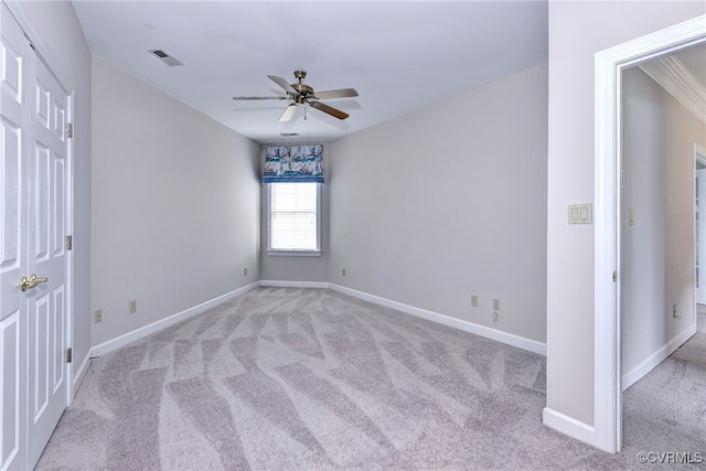 carpeted empty room with ceiling fan