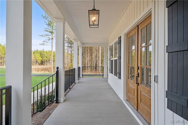 view of patio featuring french doors and covered porch