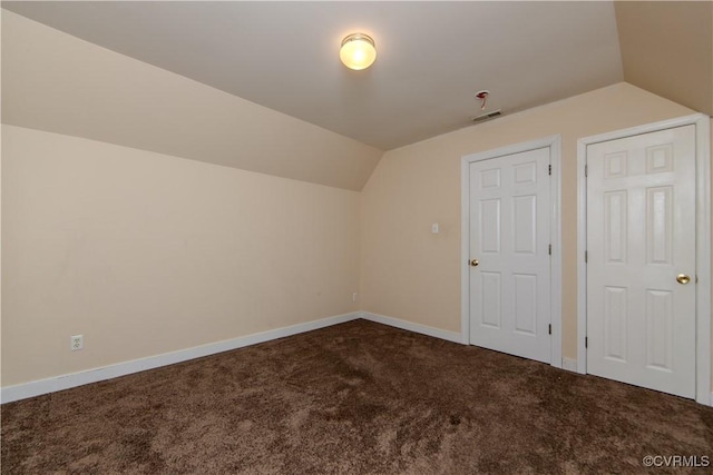 bonus room featuring carpet floors and vaulted ceiling