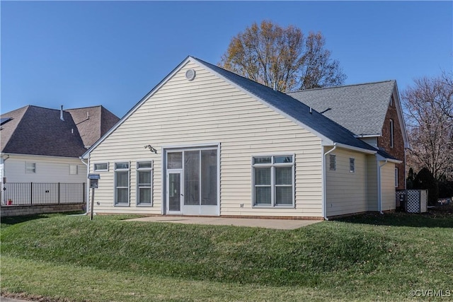 rear view of house with a lawn