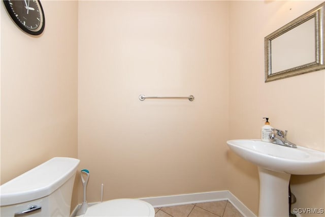 bathroom featuring tile patterned floors and toilet