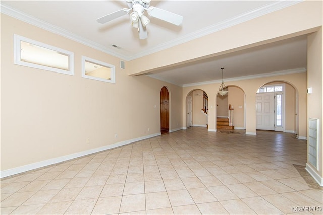 unfurnished room with ceiling fan, ornamental molding, and light tile patterned floors