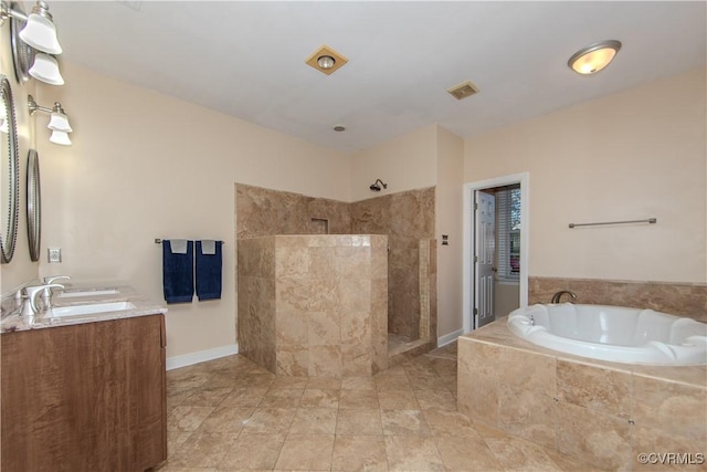 bathroom with vanity and separate shower and tub