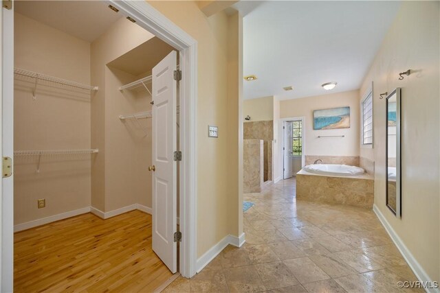 bathroom with vanity and tiled shower