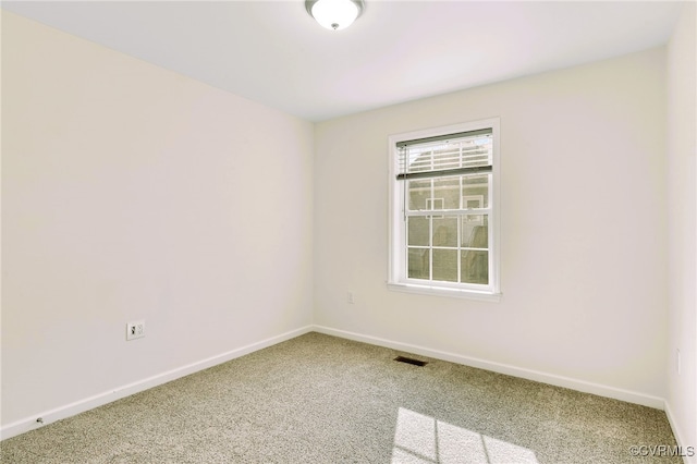 unfurnished room with carpet floors