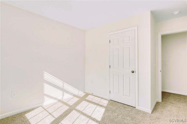 corridor with light colored carpet