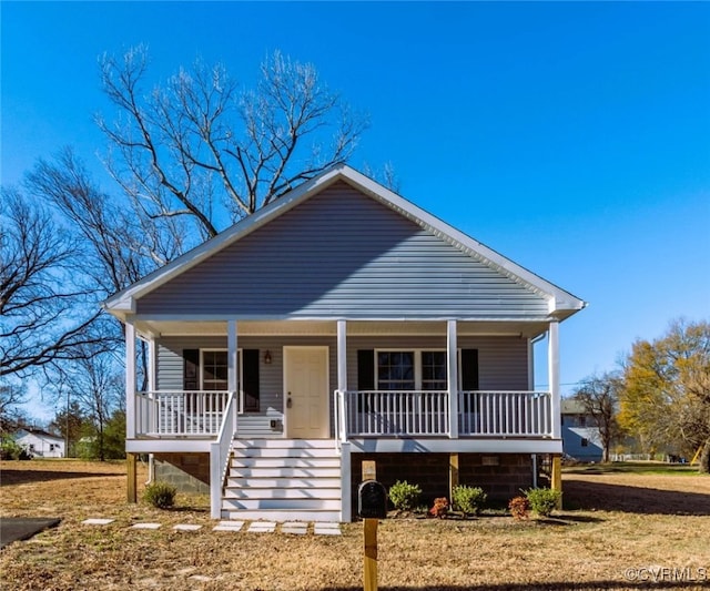 bungalow-style home featuring a porch and a front lawn