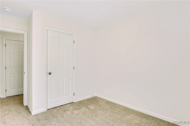 unfurnished bedroom featuring light colored carpet