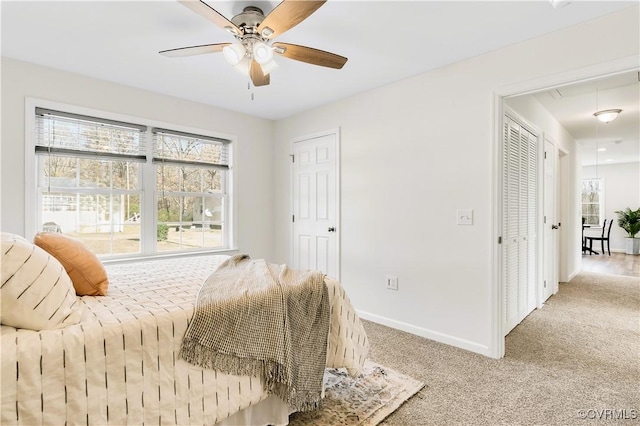 carpeted bedroom featuring ceiling fan