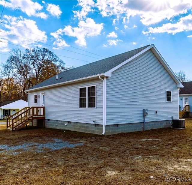 back of house featuring central AC unit