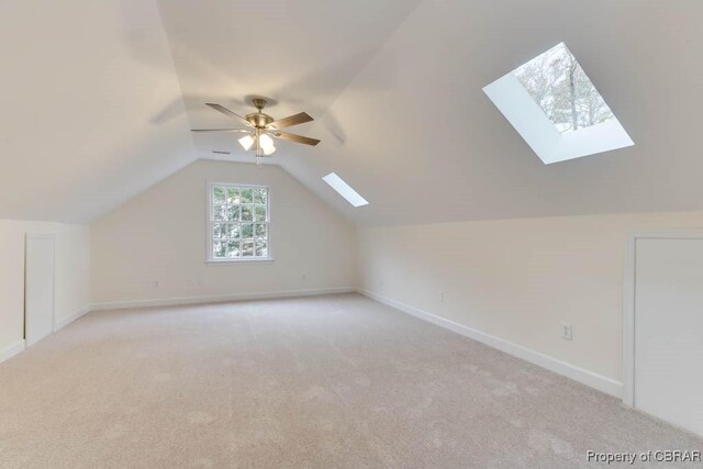 bonus room featuring light carpet, vaulted ceiling, and ceiling fan