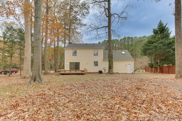 back of house with a wooden deck