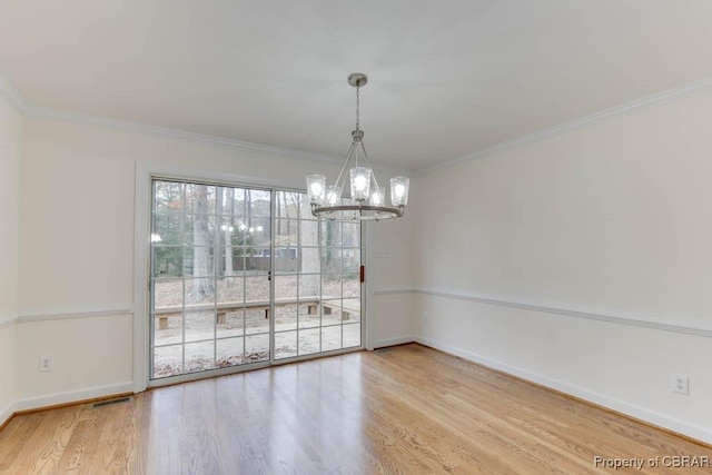 unfurnished dining area featuring light hardwood / wood-style flooring and ornamental molding