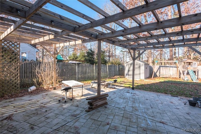 view of patio / terrace featuring a pergola and a playground