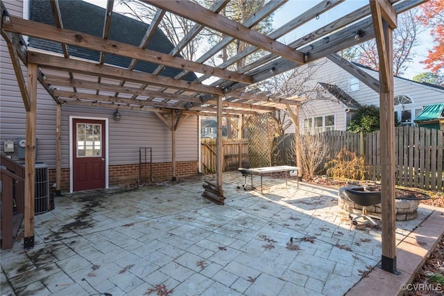 view of patio with a pergola, an outdoor fire pit, and central air condition unit