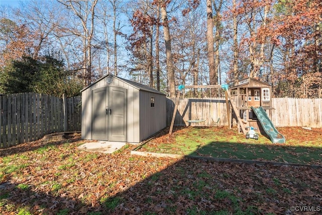 view of outbuilding featuring a lawn and a playground