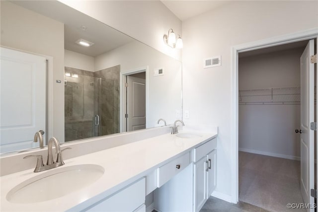 bathroom with vanity and an enclosed shower