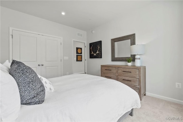 carpeted bedroom with a closet