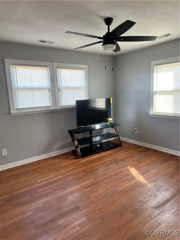 sitting room featuring hardwood / wood-style flooring and ceiling fan